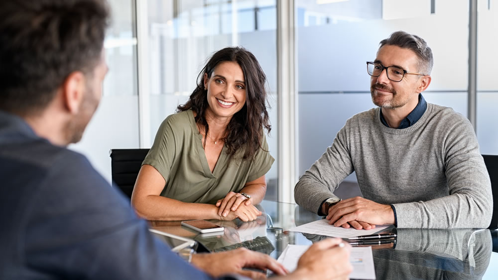 Mortgage Loan Originator assisting couple with their new home purchase